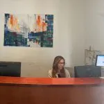 A staff member at the Tel Aviv Doctor clinic reception