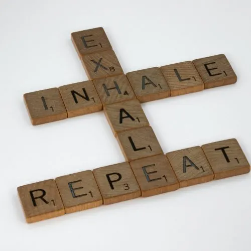 brett-jordan-osYax0ZmZRk-unsplash Scrabble tiles spelling “inhale, exhale, repeat” — a breathing and stress-relief motif