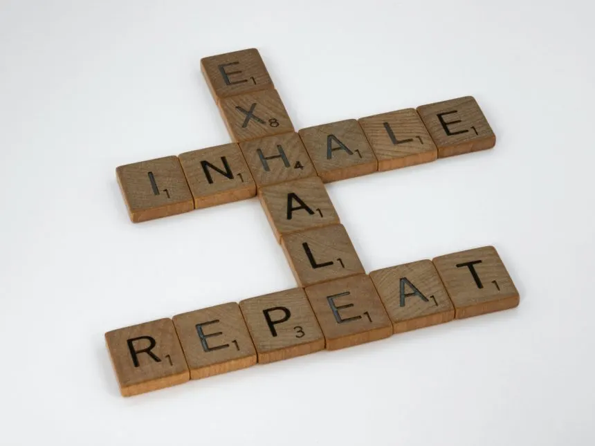 brett-jordan-osYax0ZmZRk-unsplash | Tel Aviv Doctor Scrabble tiles spelling “inhale, exhale, repeat” — a breathing and stress-relief motif